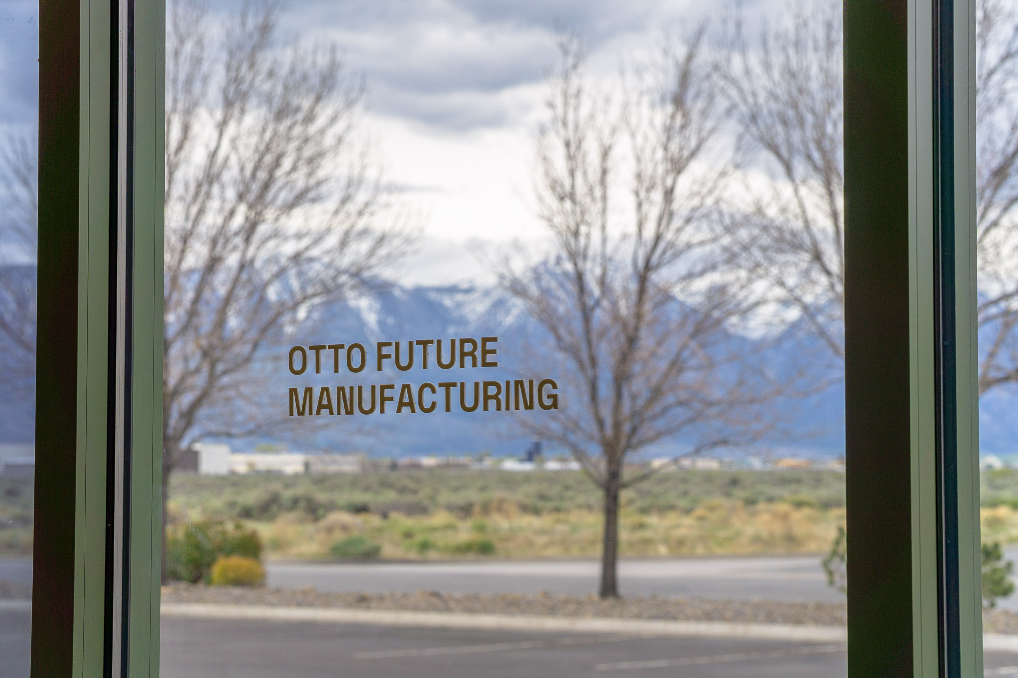 OTTO Future Manufacturing facility entrance with the Sierra Nevada in the distance